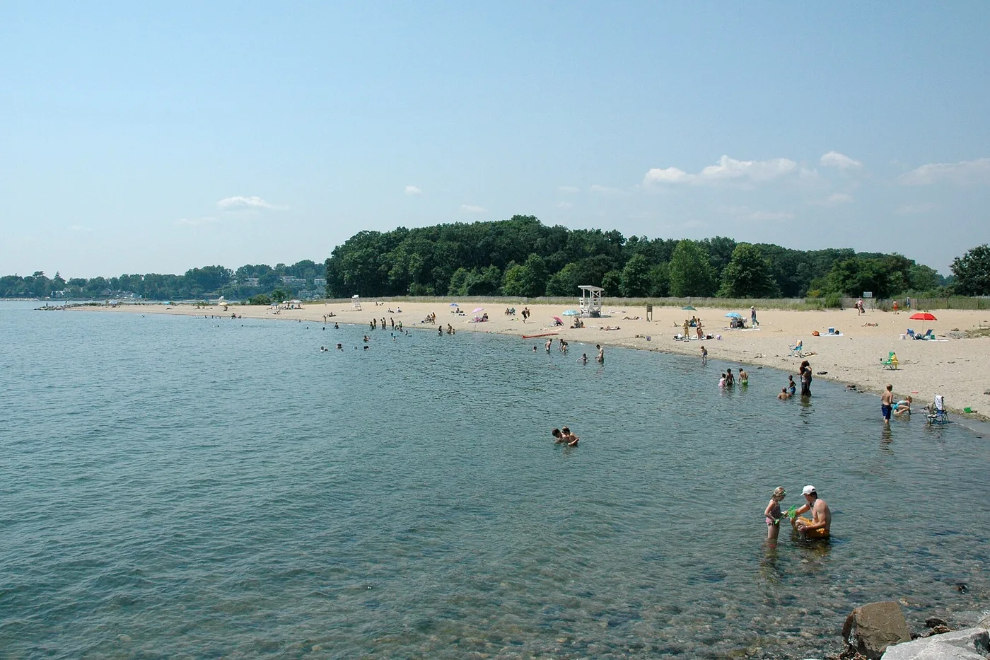 Families in the water at Sherwood Island State Park on the Fairfield County shore