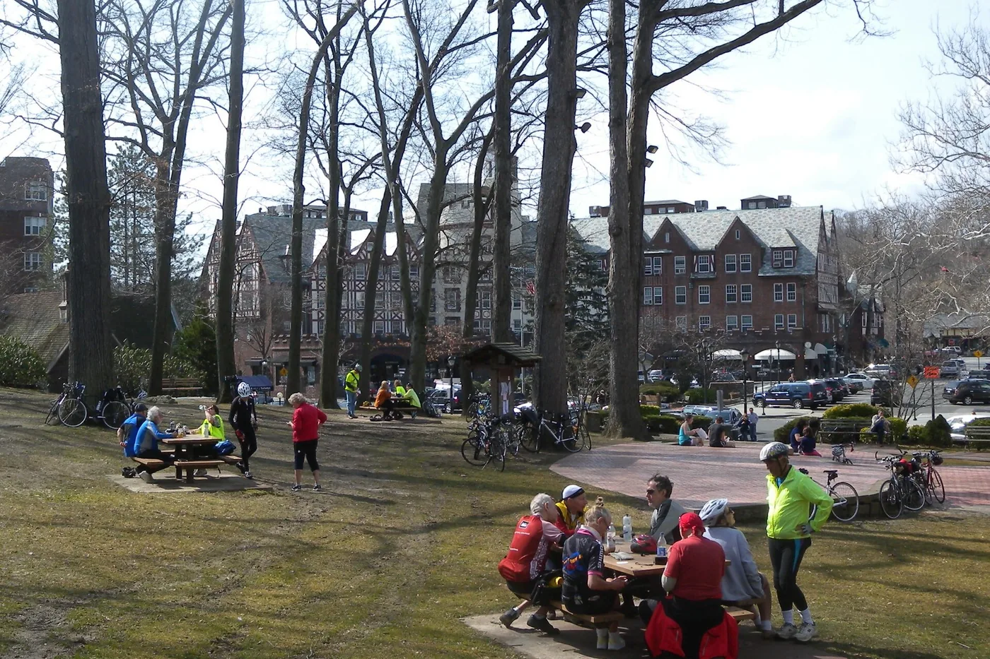 People at picnic tables in a park in Scarsdale, New York