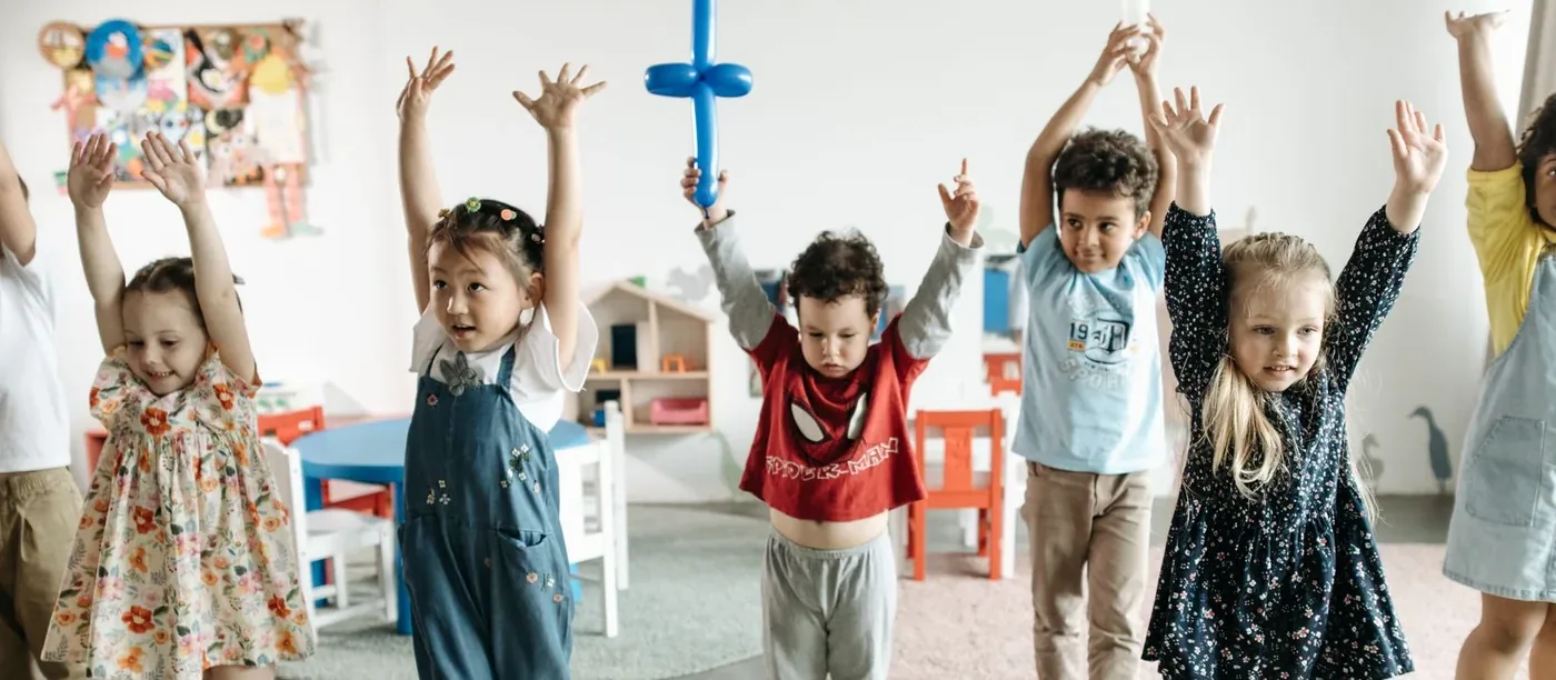 A group of young children playing together at an event