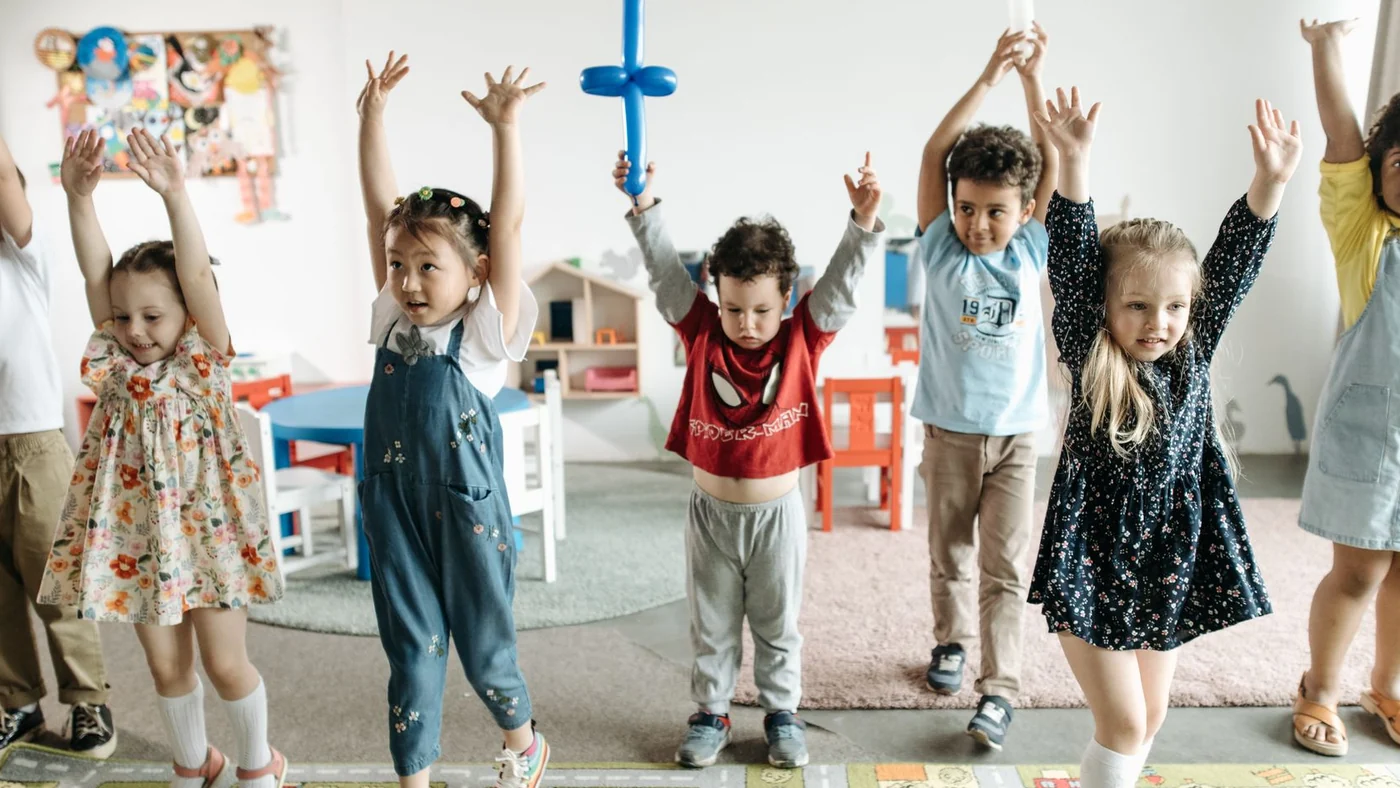 A group of young children playing together at an event